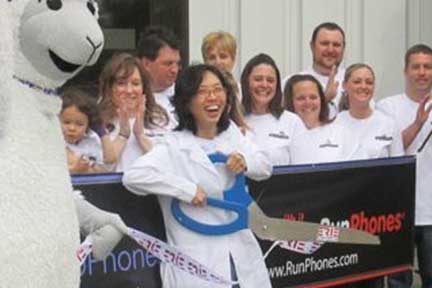 baby watches as ceo mom features in a ribbon-cutting ceremony