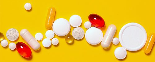 a variety of sleeping pills are displayed on a yellow background