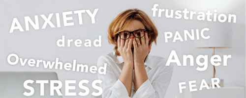 Distressed woman wearing glasses and a white collared shirt is covering eyes with hands.